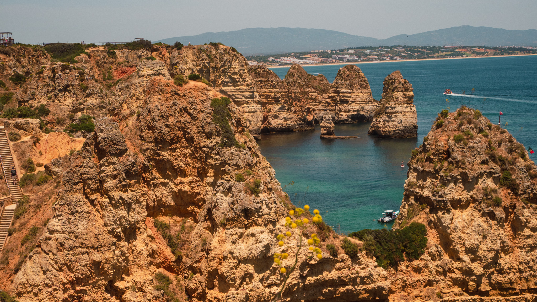 A quiet cove with turquoise water and ochre cliffs near Ponta da Piedade