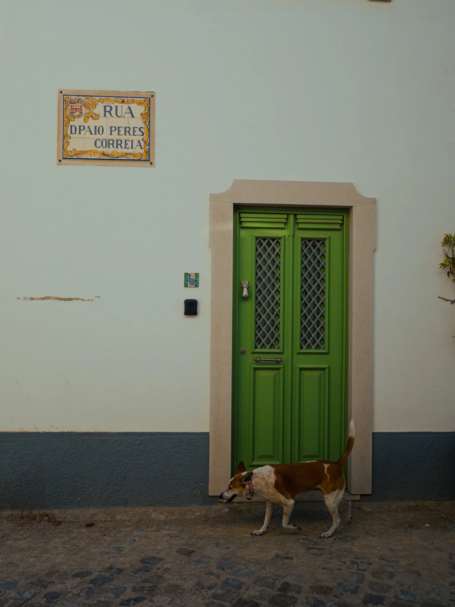 A whitewashed church tower in Tavira