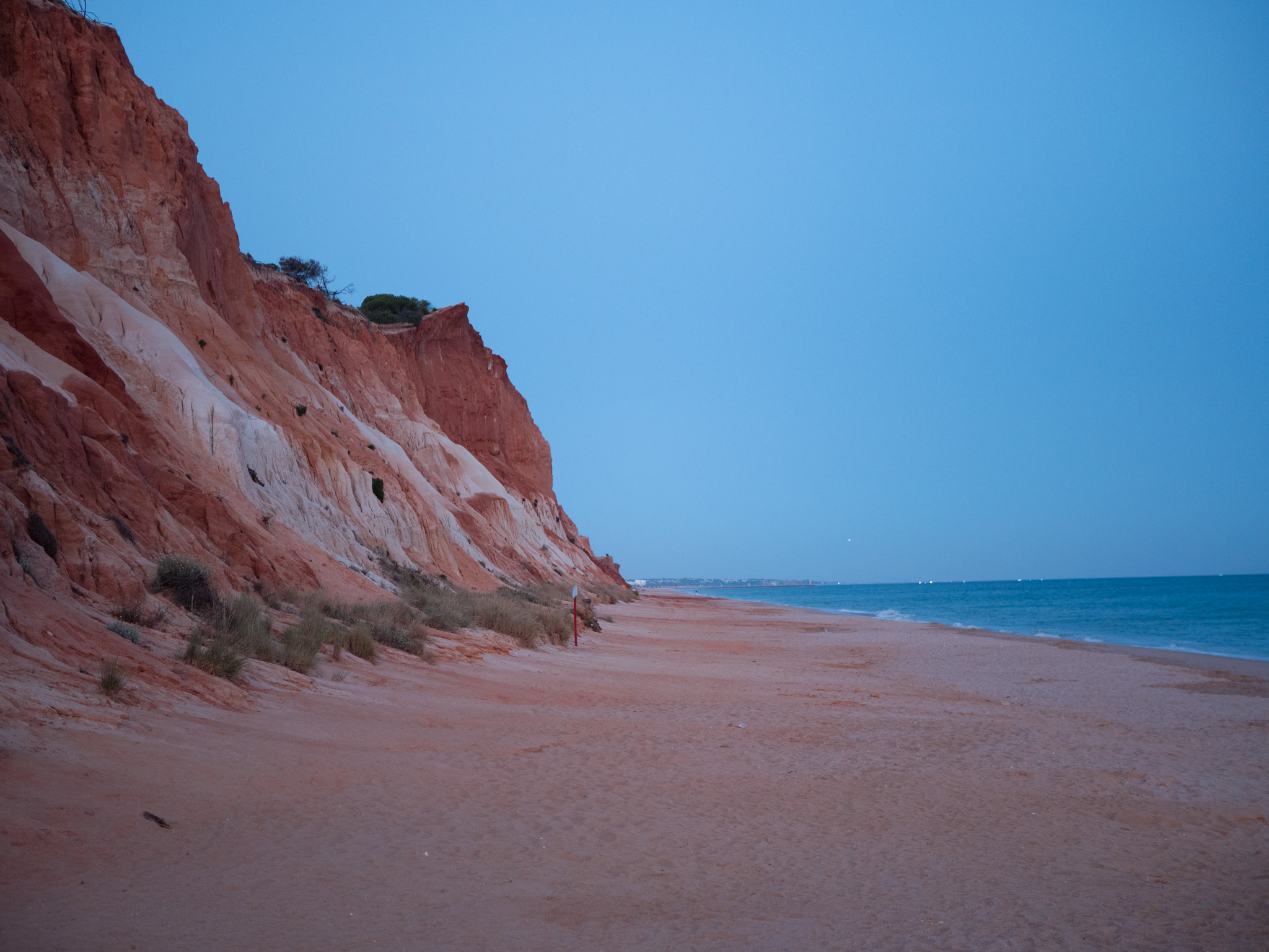 The ochre cliffs and turquoise sea at Praia da Falésia