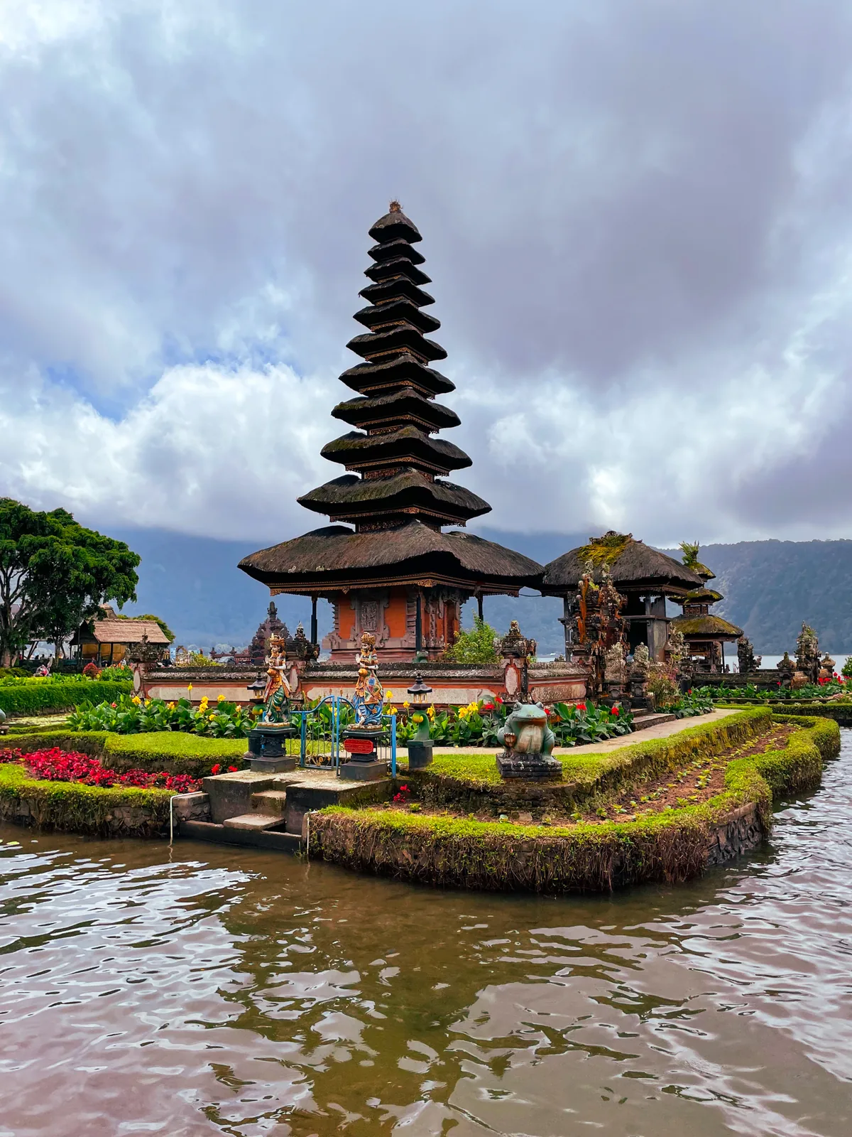 Ulun Danu Beratan: a tiered meru shrine on Lake Beratan under a cloudy sky