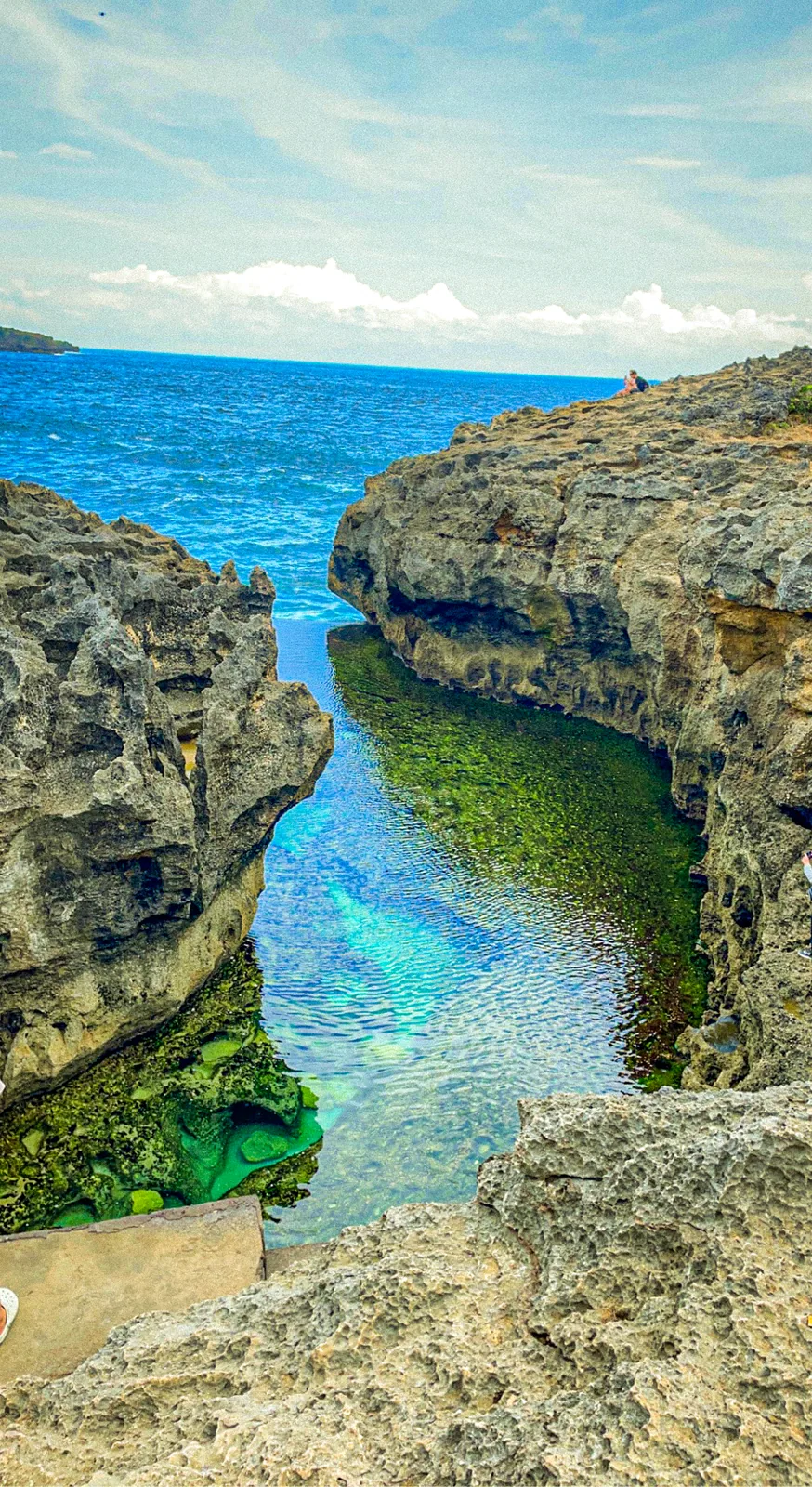 Angel's Billabong, a clear green rock pool between limestone cliffs